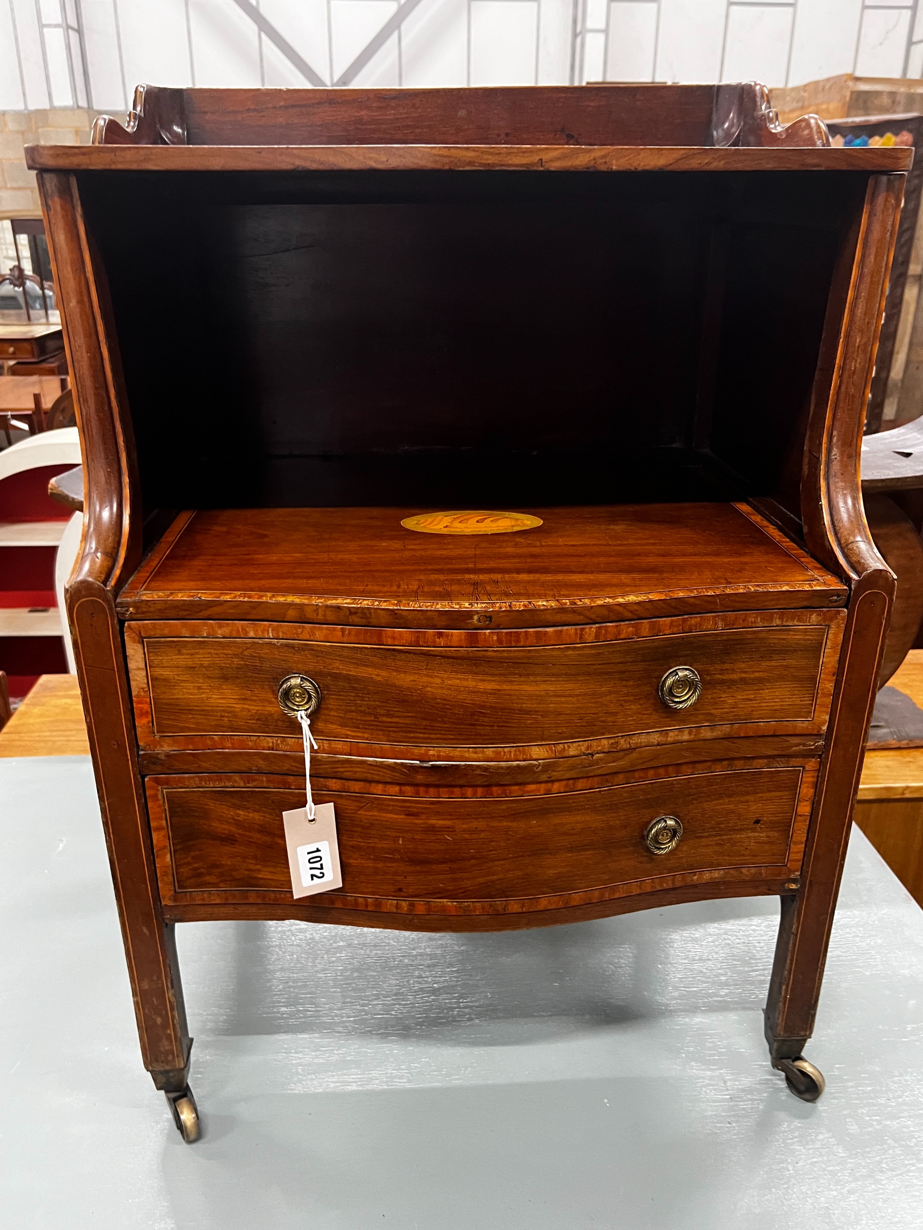 A George III inlaid mahogany serpentine front bedside chest, width 55cm, depth 42cm, height 80cm